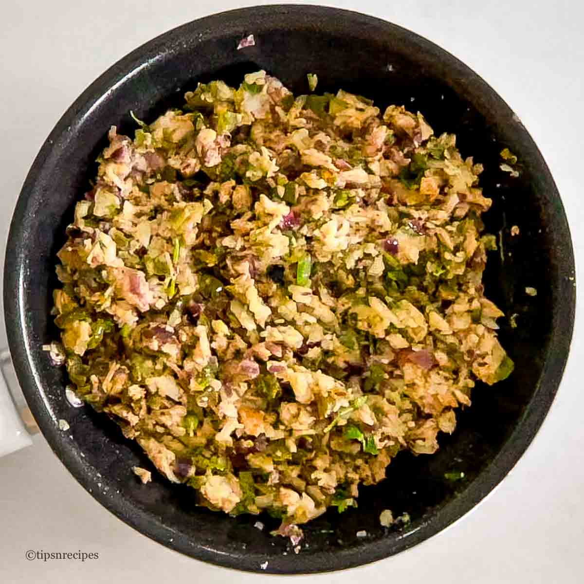 A pan of chicken filling for bread rolls.