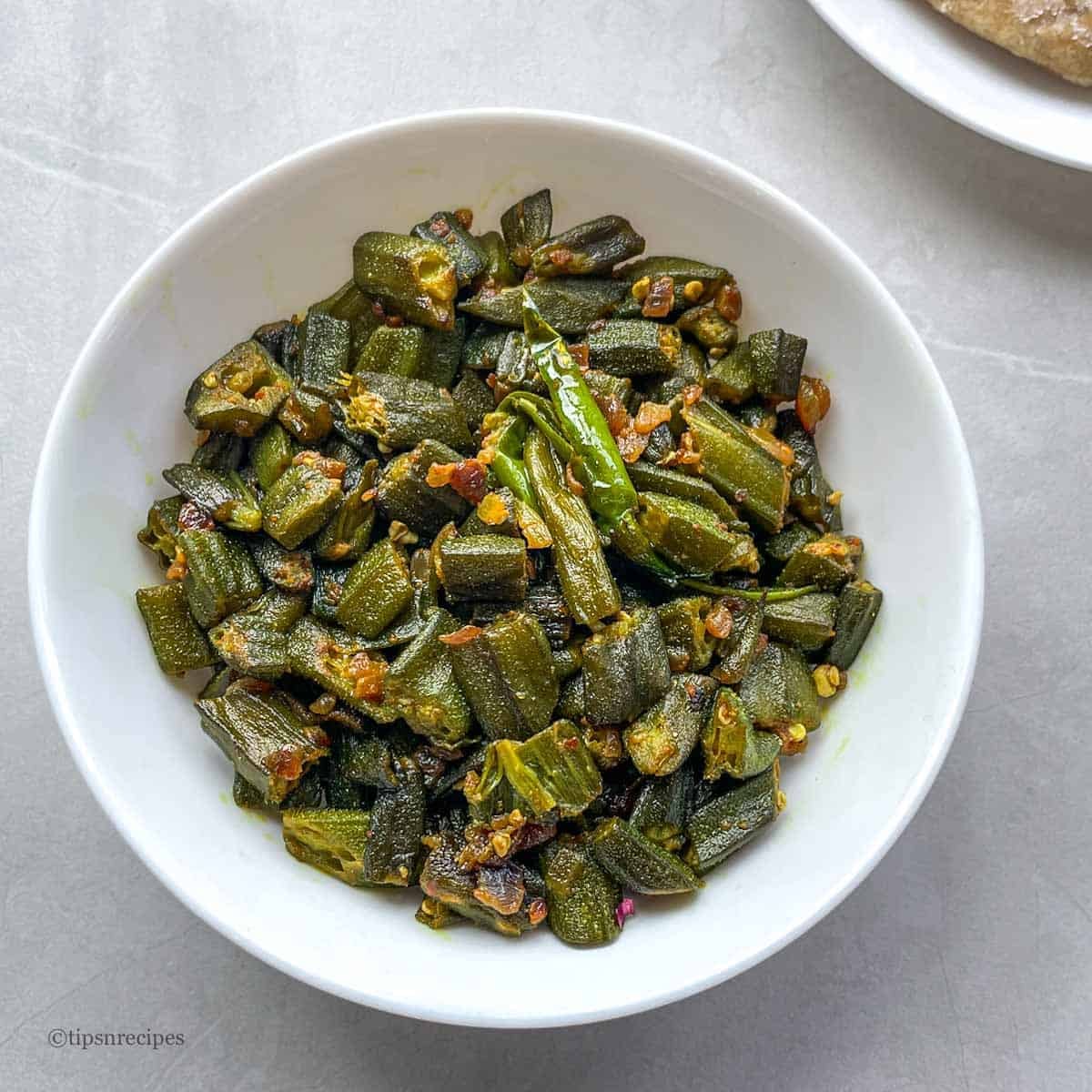 A bowl of cooked frozen okra.