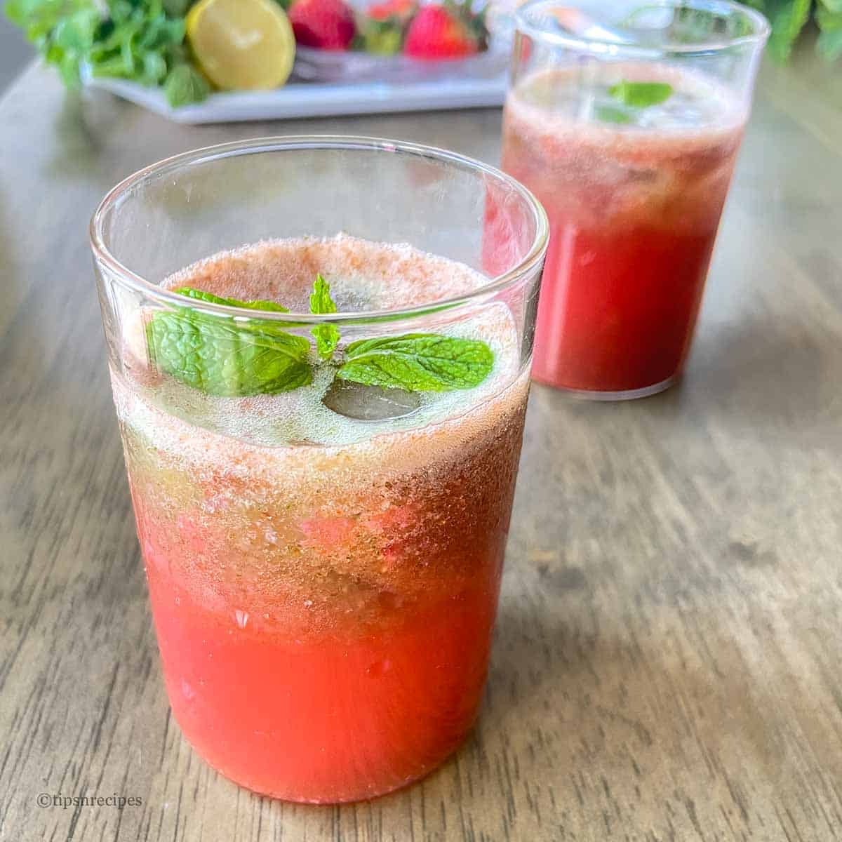 Strawberry mint lemon drink glasses on the table.