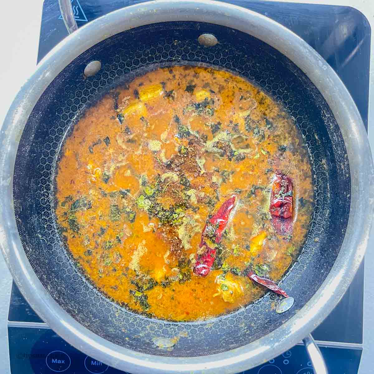 Finished with dried fenugreek leaves on butter chicken curry
