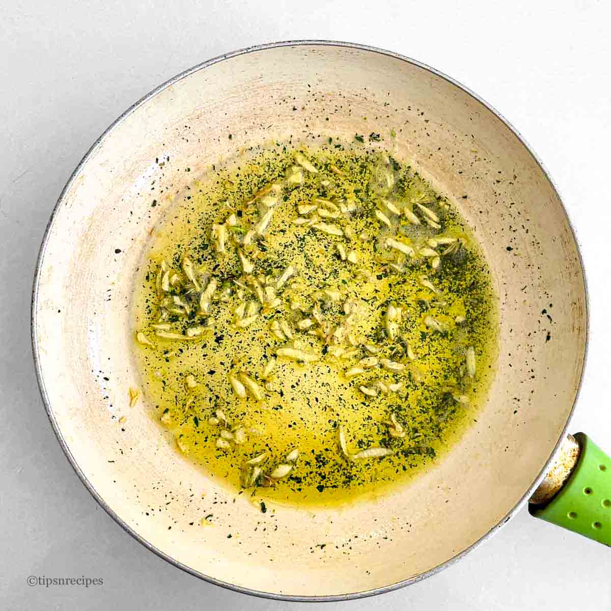 A pan of galic and mint infused oil.