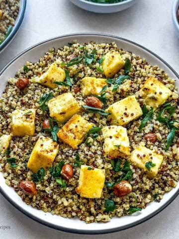 A bowl of quinoa, Indian cottage cheese and nuts.