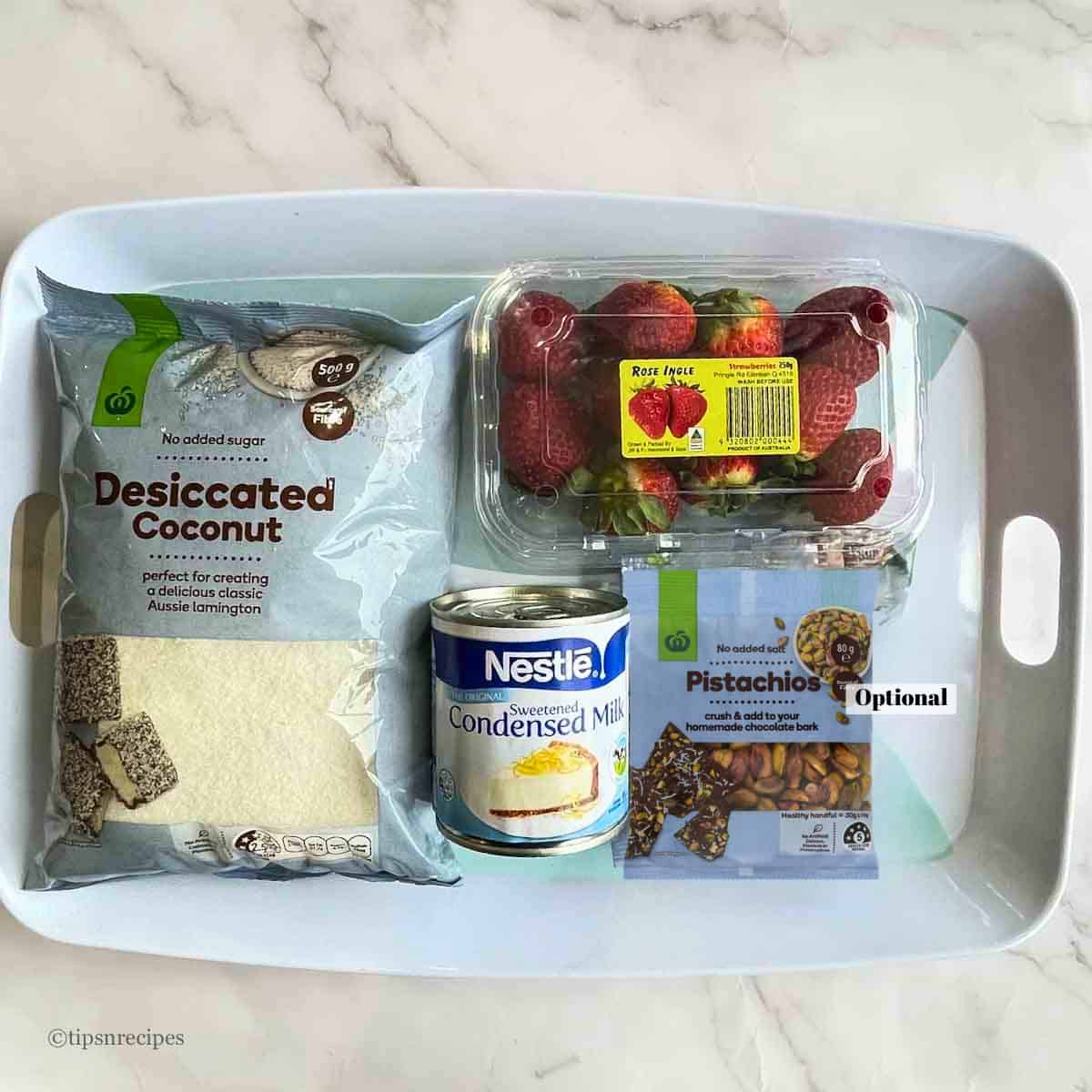 Ingredients for coconut bars with fresh strawberry dessert.