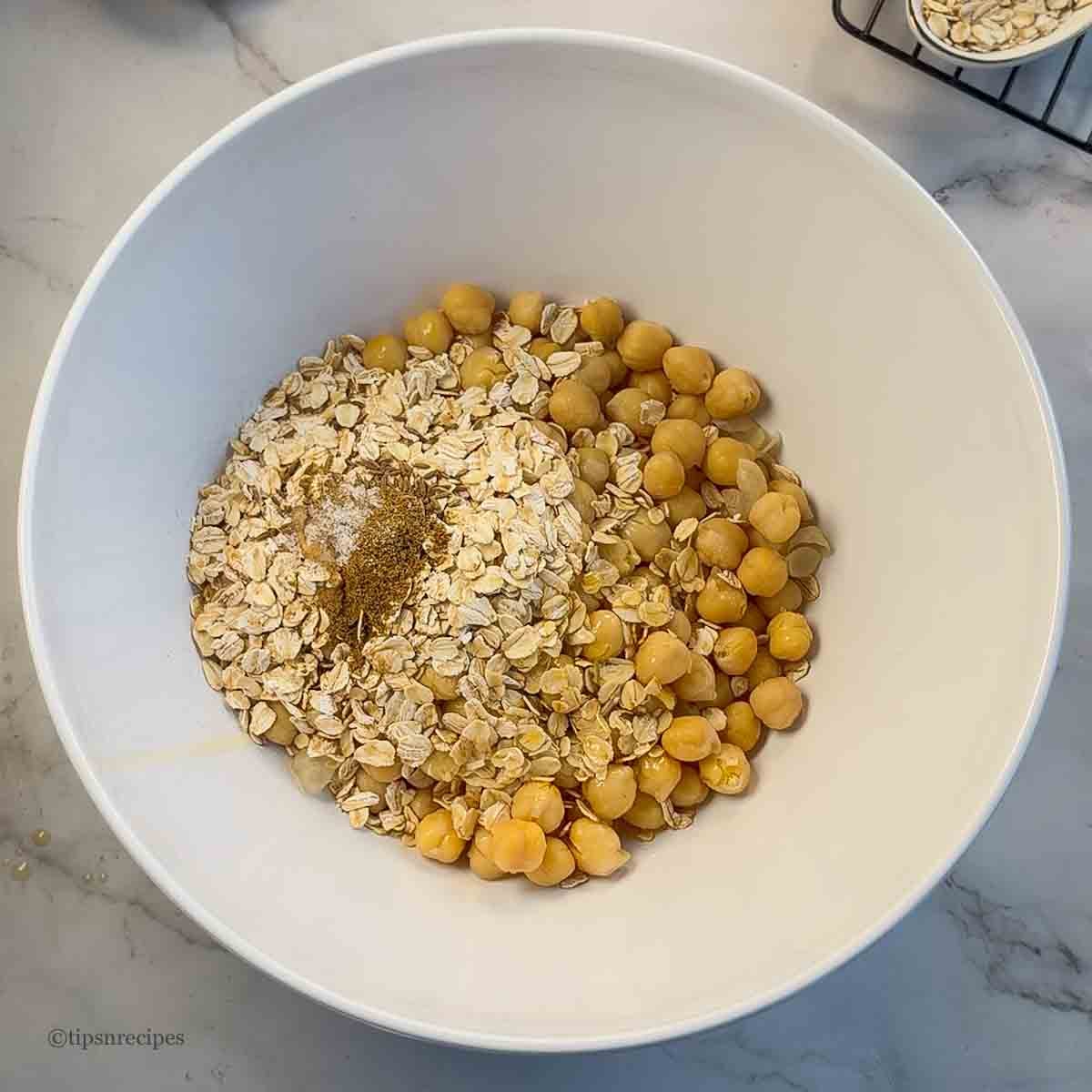 All ingredients for chickpea oat crackers mixed in a bowl.