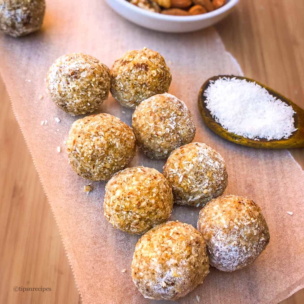Dry fruit balls with coconut flakes.